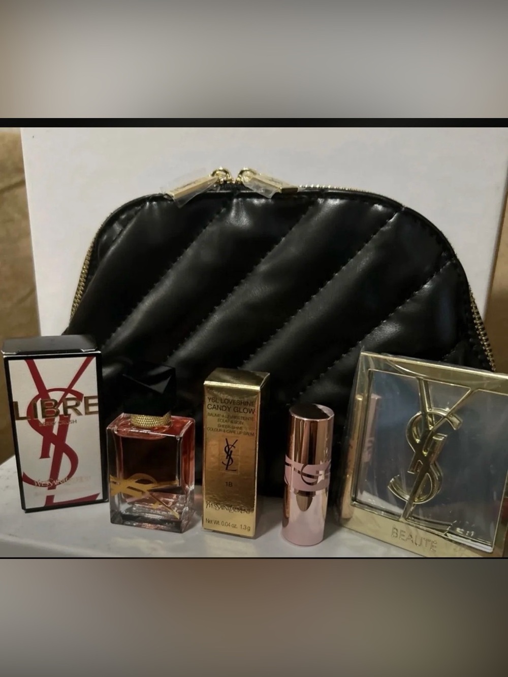 Yves Saint Laurent Black Quilted Cosmetic Pouch with Gold Accents and Beauty Set